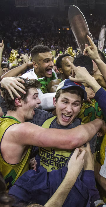 Image: Notre Dame’s Steve Vasturia celebrates on the court with fans