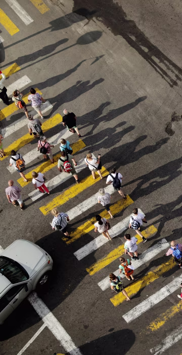 Image: A large group of tourists walk through the historic Old Havana