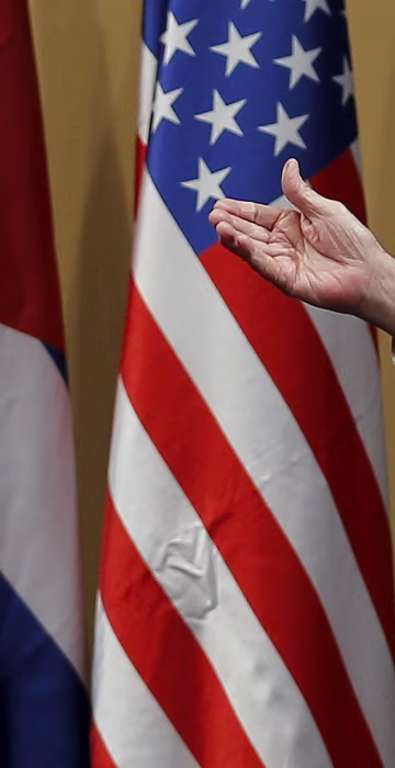 Image: The hands of U.S. President Barack Obama and Cuban President Raul Castro are seen during a news conference as part of Obama's three-day visit to Cuba, in Havana