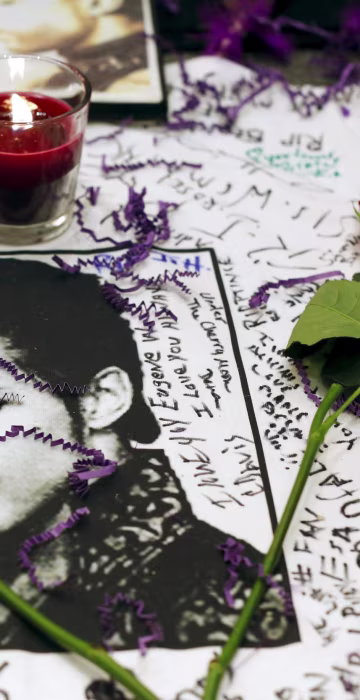 Image: Flowers and candles are placed at a makeshift memorial for the music legend in Harlem, New York