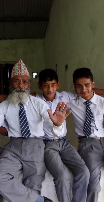 Image: Durga Kami with classmates outside their classroom