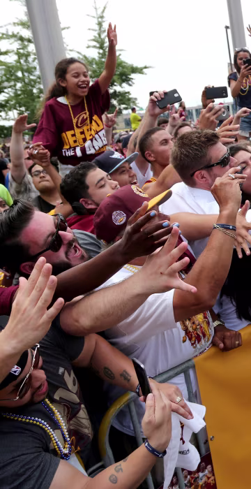 Image: Cleveland Cavaliers Iman Shumpert celebrates with the crowd in downtown Cleveland