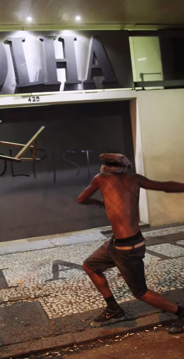 Image: A demonstrator attacks the Folha de S. Paulo newspaper office during a protest against Brazil's new President Michel Temer after Brazil's Senate removed former President Dilma Rousseff in Sao Paulo