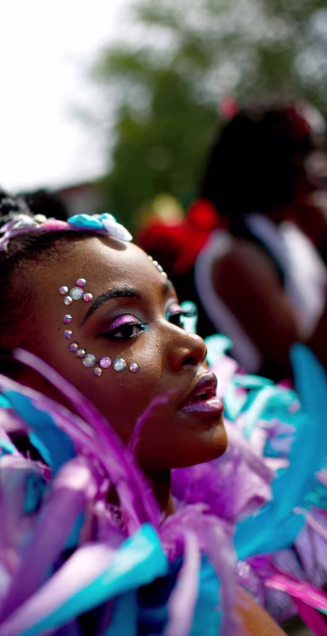 Image: Participants dance during the West Indian Day Parade in the Brooklyn borough of New York