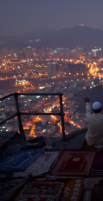 Image: A pilgrim prays at Mount Al-Noor ahead of the annual haj pilgrimage in the holy city of Mecca