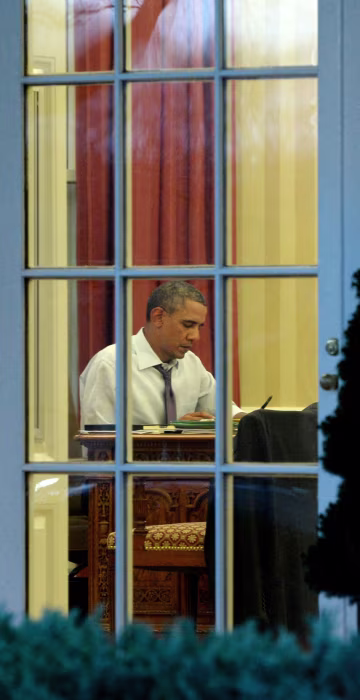 Image: President Barack Obama works on a draft of his State of the Union address