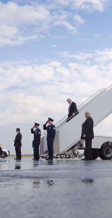 Image: President Donald Trump walks down the stairs of Air Force One upon he arrival at Philadelphia International Airport, Jan. 26, 2017.