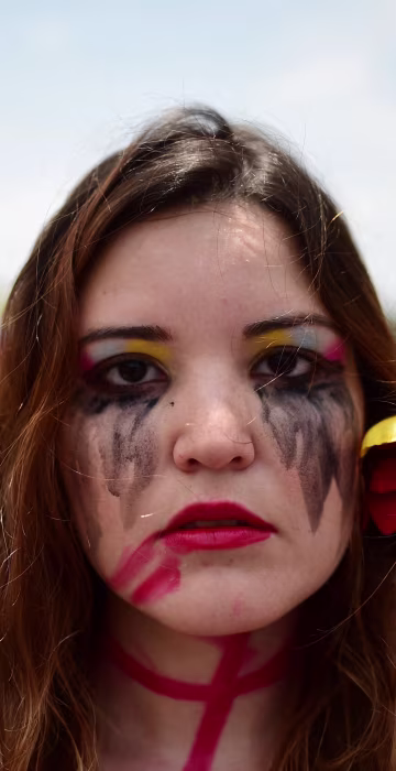 Image: An opposition activist participates in a sit-in in Caracas