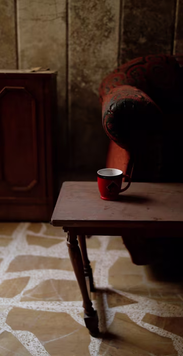 Image: A coffee mug is seen on a table at a compound used as a prison by Islamic State militants