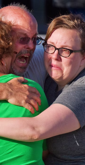 Image: Tom Sullivan embraces family members