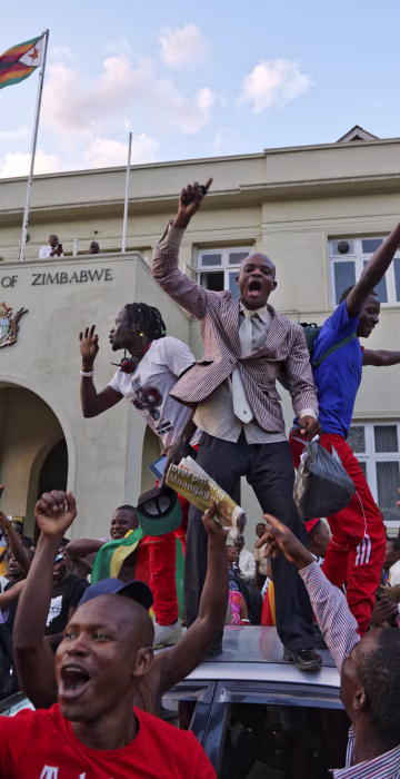 Image: Zimbabweans celebrate outside the parliament building