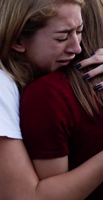 Students mourn during a candlelight vigil.