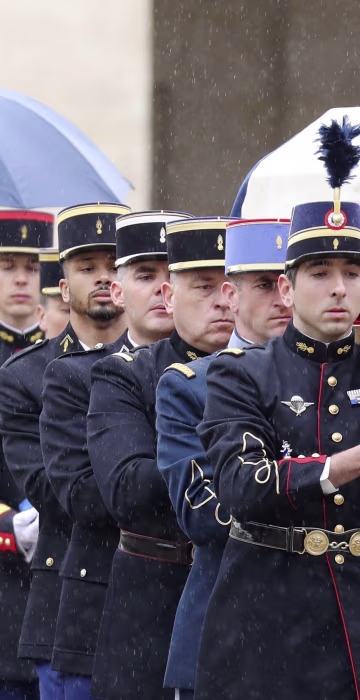 Image: French Republican Guards and cadets from the joint-army military school carry the coffin