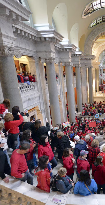 Thousands of teachers from across Kentucky fill the state Capitol to rally for increased funding and to protest last minute changes to their state funded pension system in Frankfort, Kentucky on April 2. This was one of several demonstrations, to include thousands more that filled the state Capitol in Oklahoma, as schools closed and educators called for increased education funding.