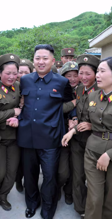 North Korean leader Kim Jong-un (C) visits the Thrice Three-Revolution Red Flag Kamnamu (persimmon tree) Company under the Korean People's Army Unit 4302 in Pyongyang, North Korea on Aug. 24, 2012.