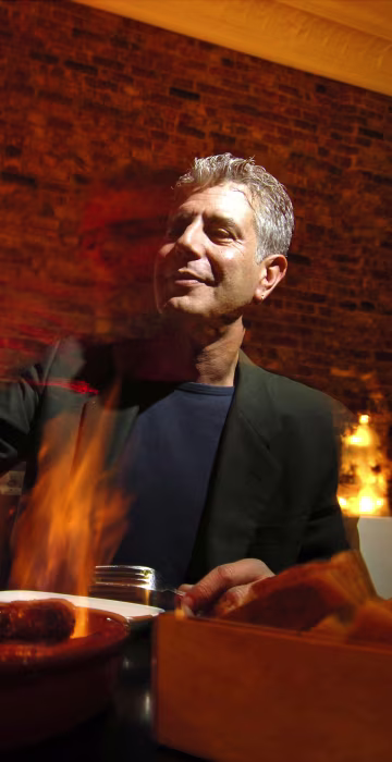 Image: Chef Anthony Bourdain has a drink at Tintol restaurant in Ti