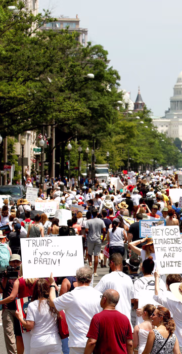 Image: Immigration activists march to protest the Trump Administration's immigration policy in Washington