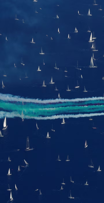 Image: The Italian Frecce Tricolori aerobatic squad performs before the start of the Barcolana regatta in front of the Trieste harbour