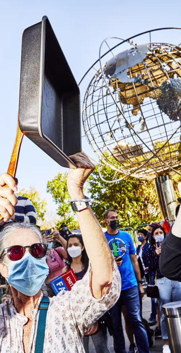 Image:New Yorkers bang pans as they celebrate in Columbus Circle.