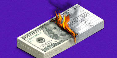 Illustration of a stack of $100 dollar bills as a stack of Covid-19 vaccination record cards burns away.