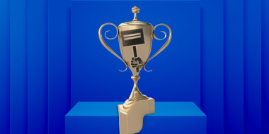 Photo illustration: A gold trophy with a hand holding a protest sign over it sitting on a pedestal and melting.