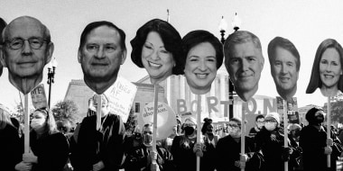 Image: Abortion rights advocates hold cutouts of the Supreme Court Justices as the court hears arguments in a Mississippi case where a 2018 law would ban abortions after 15 weeks of pregnancy on Dec. 1, 2021.