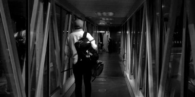 Image: A passenger walks towards the plane while boarding a flight.