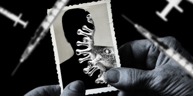 Photo illustration: A hand holding a photograph that shows the silouette of a person revealing a Covid spore. Blurred vaccine syringes float around it.