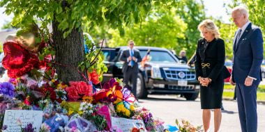 President Joe Biden and first lady Jill Biden pay their respects to the victims of Saturday's shooting at a memorial across the street from the TOPS Market in Buffalo, N.Y., on May 17, 2022.