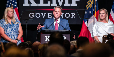 Brian Kemp, governor of Georgia, center, speaks during an Election Night Party in Atlanta on May 24, 2022.