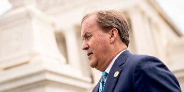 Texas Attorney General Ken Paxton speaks outside the Supreme Court in Washington on April 26, 2022.