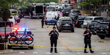 Image: First responders take away victims from the scene of a mass shooting at a Fourth of July parade in Highland Park, Ill., on July 4, 2022.