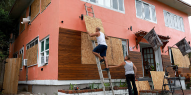 Florida Residents Prepare For Hurricane Ian, board up apartment building