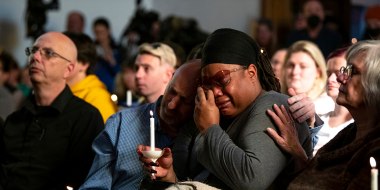Tyrice Kelley, center right, a performer at Club Q, is comforted during a service at All Souls Unitarian Church in Colorado Springs, on Nov. 20, 2022. 