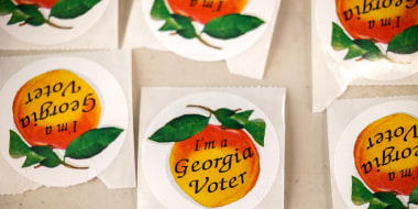 Image: Stickers with peaches and text that read,"I'm a Georgia Voter".