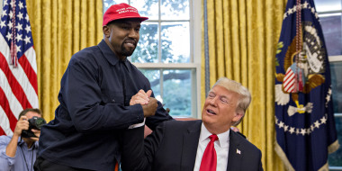 Ye, formerly Kanye West, shakes hands with then-President Donald Trump at the White House