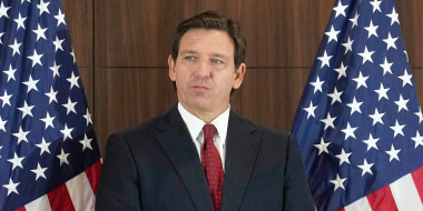 Governor Ron DeSantis listens to others during a news conference where he spoke of new law enforcement legislation that will be introduced during the upcoming session, Thursday, Jan. 26, 2023, in Miami.