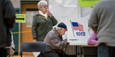 A man votes at a polling station during the New Hampshire primary in Hookset, N.H. 