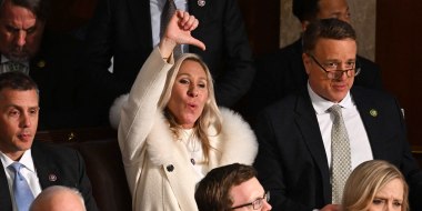 US Republican Representative Marjorie Taylor Greene (R-GA) gives a thumb down as US President Joe Biden delivers the State of the Union address at the US Capitol in Washington, DC, February 7, 2023.