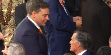 From left, Rep. George Santos, R-N.Y., speaks with Sen. Mitt Romney, R-Utah, before the start of the State of the Union address at the U.S. Capitol, on Tuesday.