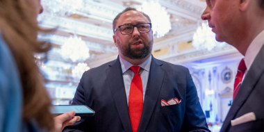 Image: Former President Donald Trump's aide Jason Miller with reporters at Mar-a-Lago on Nov. 8, 2022.