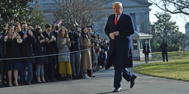 Then-President Donald Trump walks by supporters outside the White House on January 12, 2021.