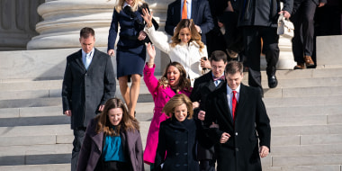 Lorie Smith, a Christian graphic artist and website designer in Colorado, center in pink, accompanied by her lawyer, Kristen Waggoner of the Alliance Defending Freedom, center bottom, walk out of the Supreme Court 