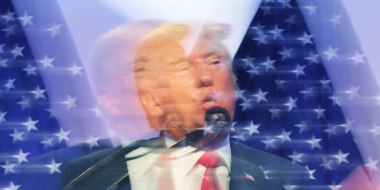 Blurry image of Donald Trump standing in front of American flag.