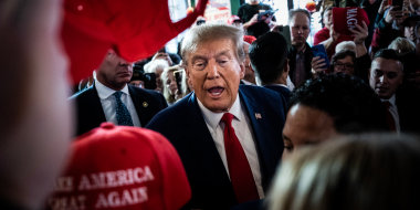Former President Donald Trump arrives to speak at a Commit to Caucus rally held at Whiskey River in Ankeny, Iowa on Dec. 2, 2023. 