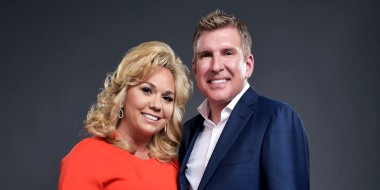 Julie and Todd Chrisley  pose for a portrait.