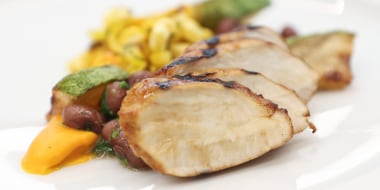 Chicken, beans, and other ingredients on a plate
