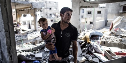 A Palestinian man looks on while standing in what remains of his house in part of the northern Beit Hanun district of the Gaza Strip after a 72-hour truce accepted by Israel and Hamas came into effect on Aug. 5, 2014.