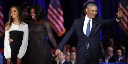 Image: First Lady Michelle Obama and President Barack Obama greet supporters as daughter Malia looks on after the President delivered his farewell address in Chicago, Illinois on Jan. 10.