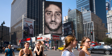 Image: People walk by a Nike advertisement featuring Colin Kaepernick on display on Sept. 6, 2018, in New York